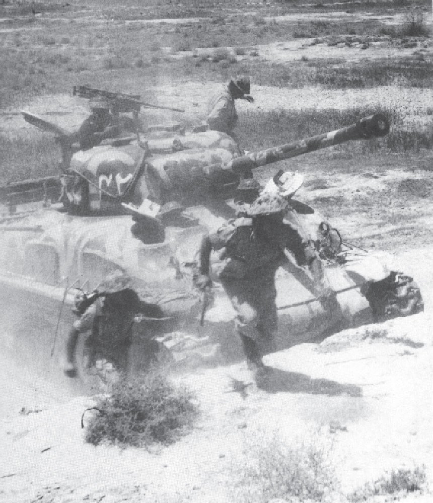 Pakistani troops in action: A dramatic picture of tank infantry assault on the Lahore front.