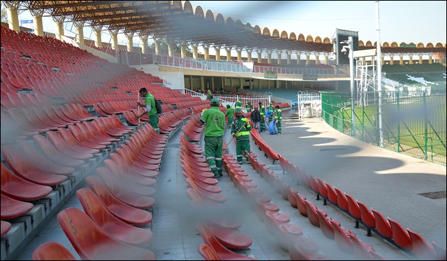 Workers busy in cleaning the Gaddafi Stadium 