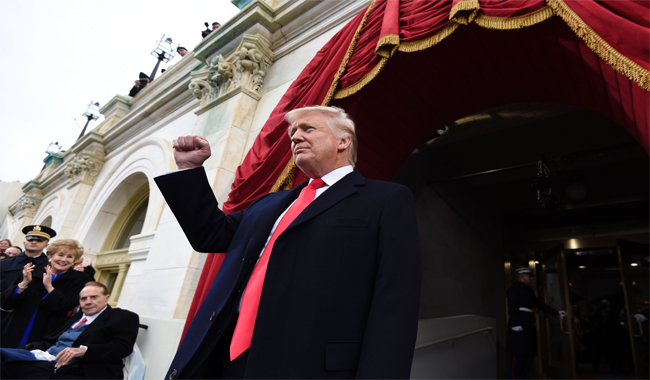 14-	US President Donald Trump arrives for his Presidential Inauguration at the US Capitol in Washington, DC.
