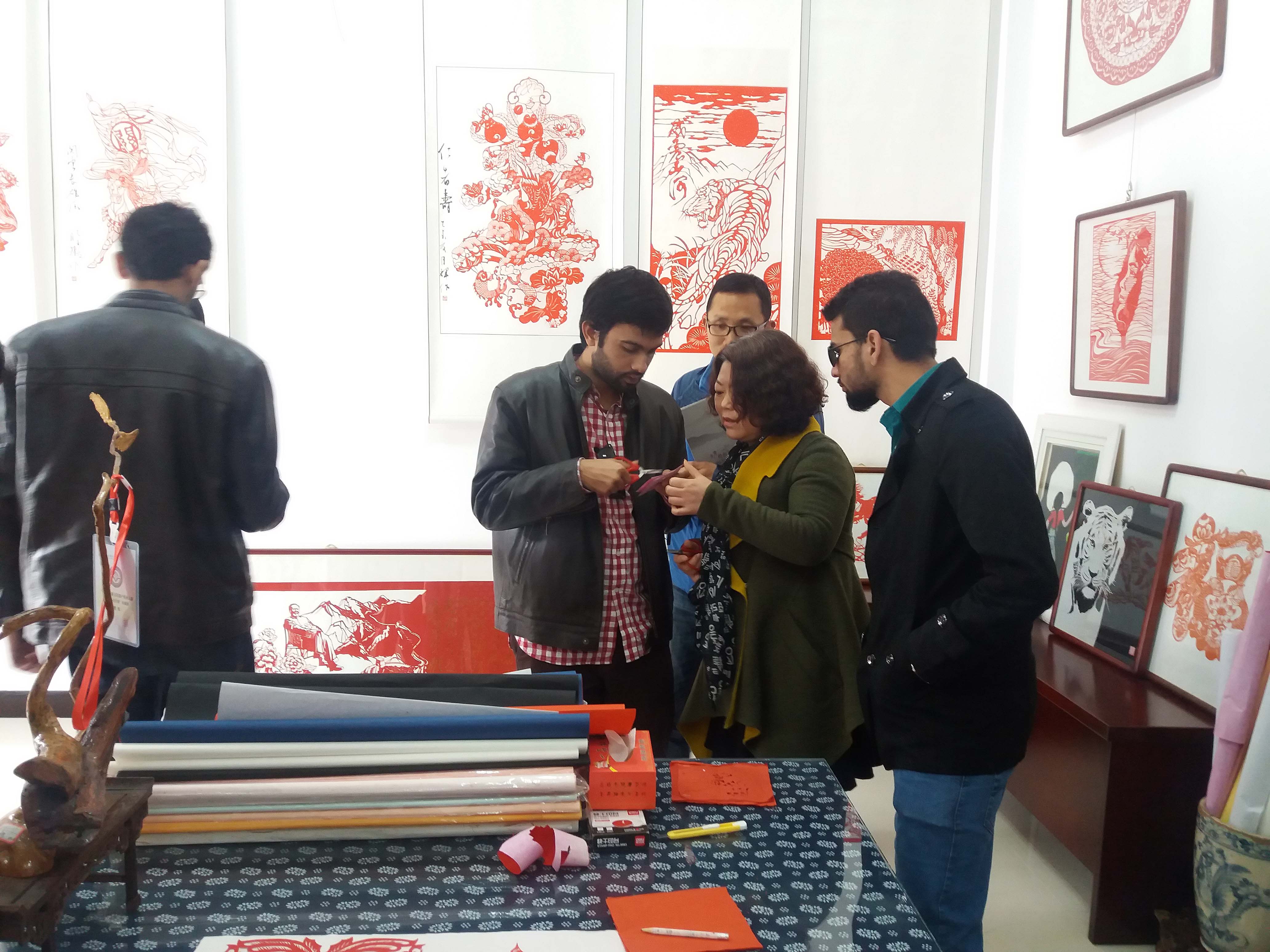 Learning Paper Cutting Art during a visit to Cultural Museum in Chongxin County
