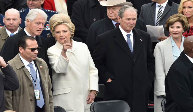 Former President Bill Clinton and his wife Hillary, Former President George W. Bush and his wife Laura on the platform of the US Capitol in Washington.