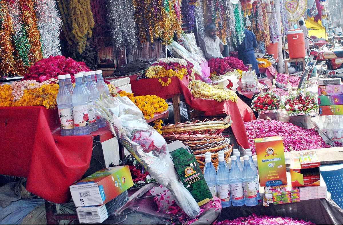 Shopkeepers display flowers and related stuff outside the sops to attract the customers on the eve of Shab-e-Barat the night of fortune and forgiveness, observed across the country with traditional religious zeal and solemnity.