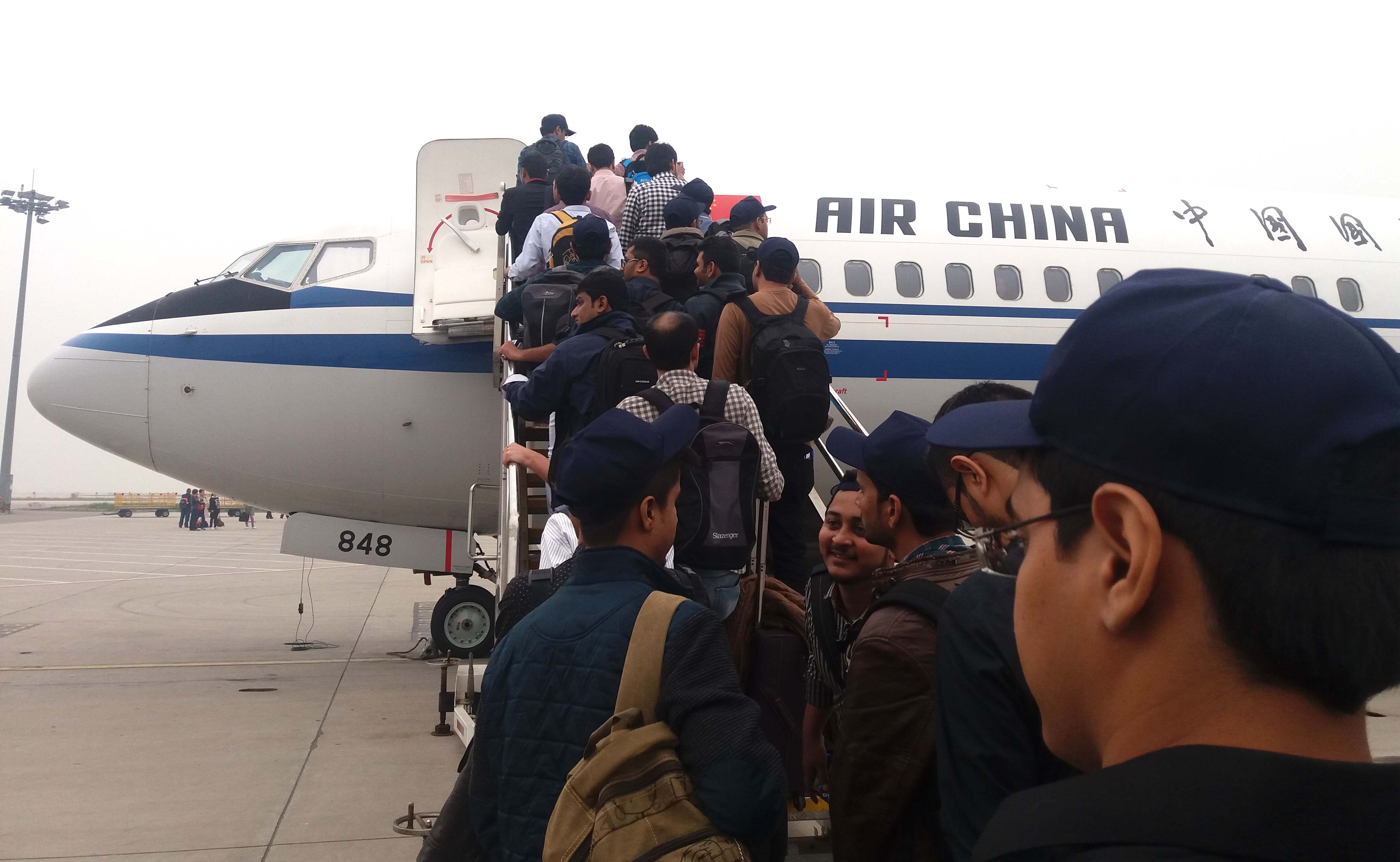 Pakistanis departing for Xian from Peking International Airport, Beijing