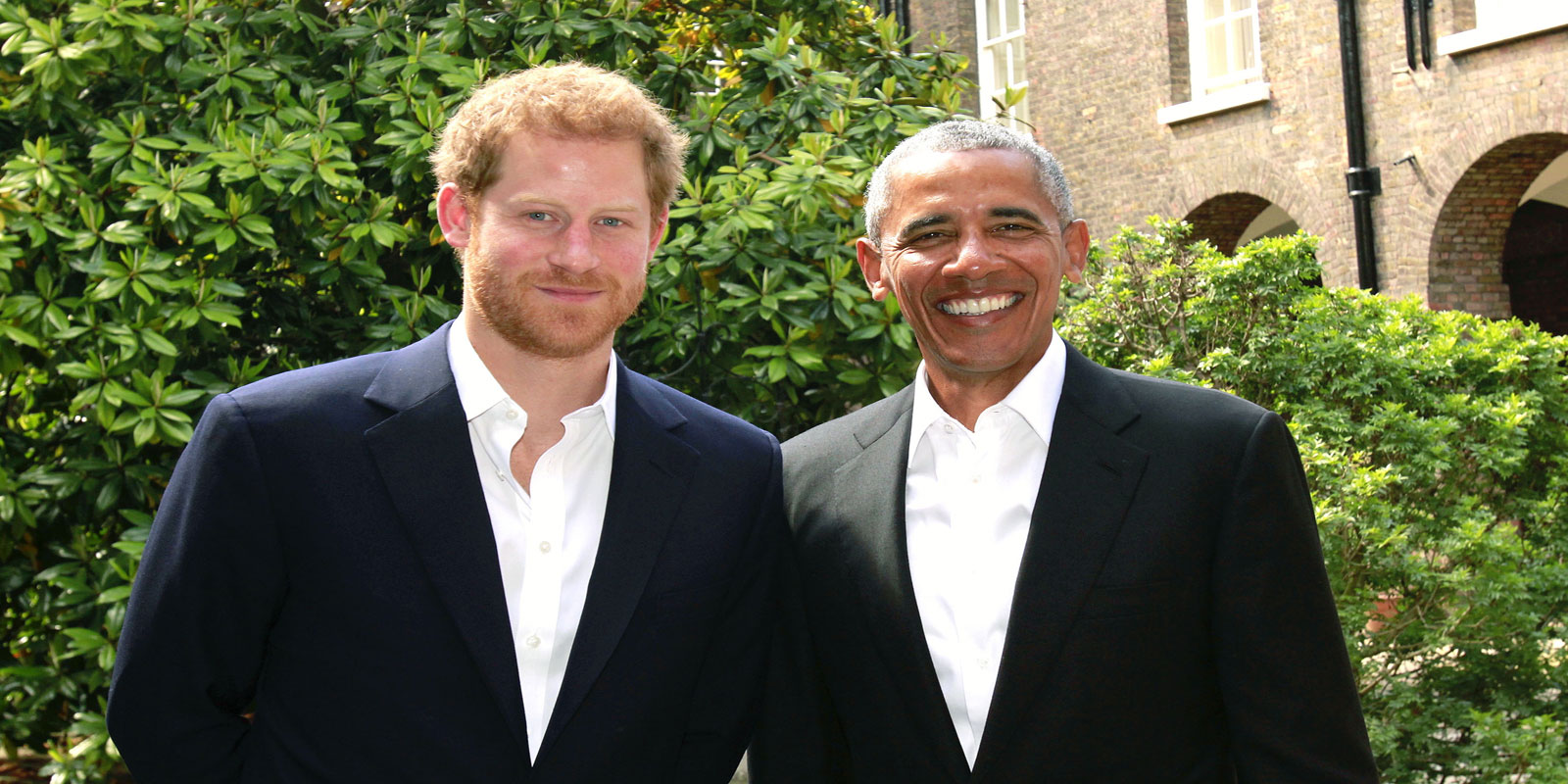 A handout out photo released by Kensington Palace shows Britain´s Prince Harry posing for a photograph with former US President US, Barack Obama following a meeting at Kensington Palace in London on May 27, 2017.