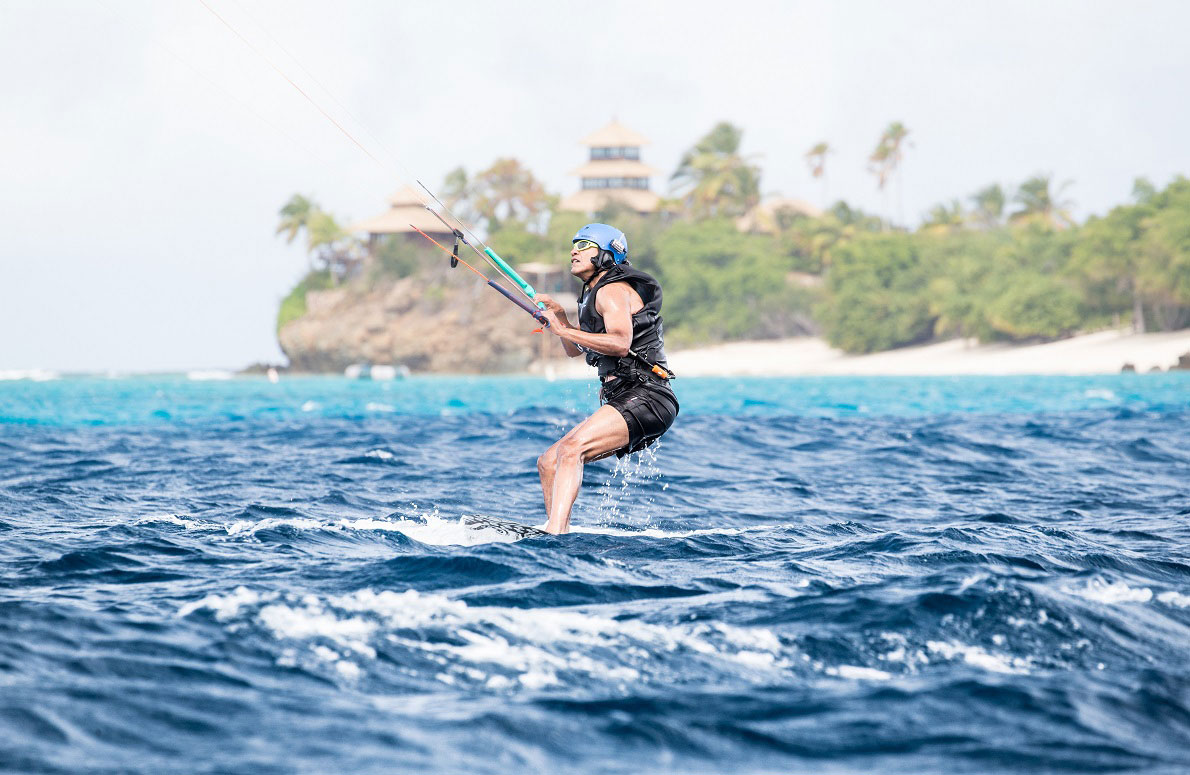 Obama tries his hand at kite surfing during a holiday with British businessman Richard Branson on his island Moskito, in the British Virgin Islands, in a picture handed out by Virgin on February 7, 2017. (REUTER)