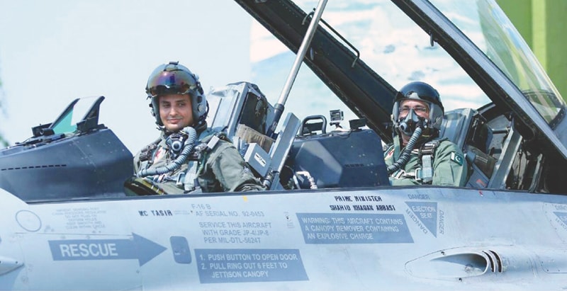 PM Shahid Khaqan Abbasi sitting in the rear cockpit of F-16 aircraft in full flying gear 