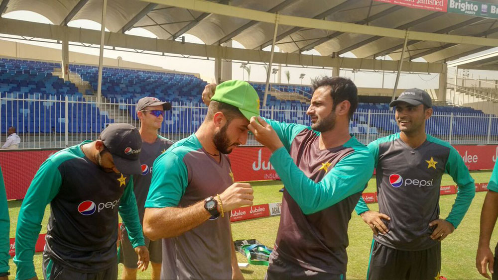 Usman Shinwari gets his ODI cap from Shoaib Malik