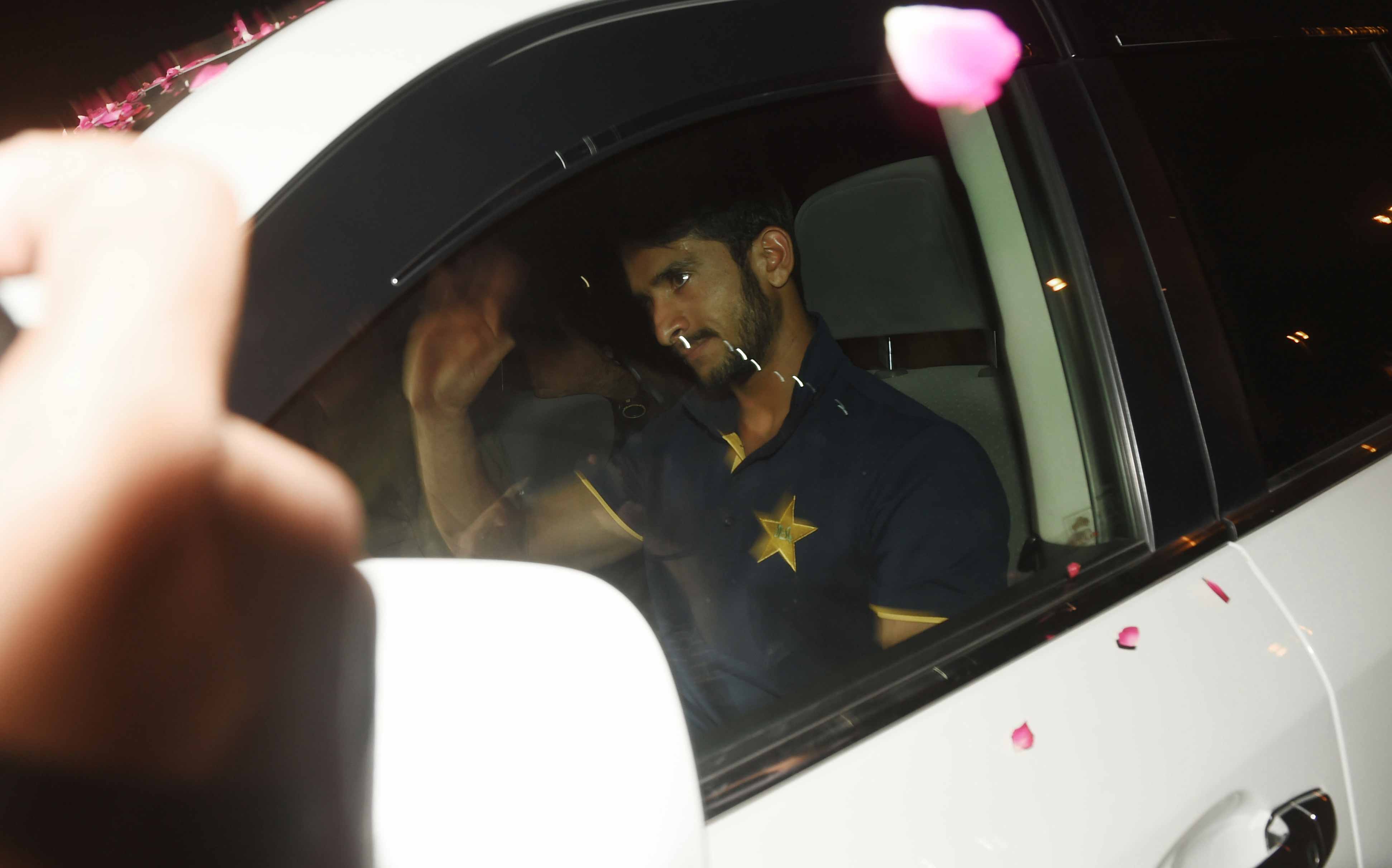 Hasan Ali waves to fans upon his arrival from London outside the Allama Iqbal International airport in Lahore.