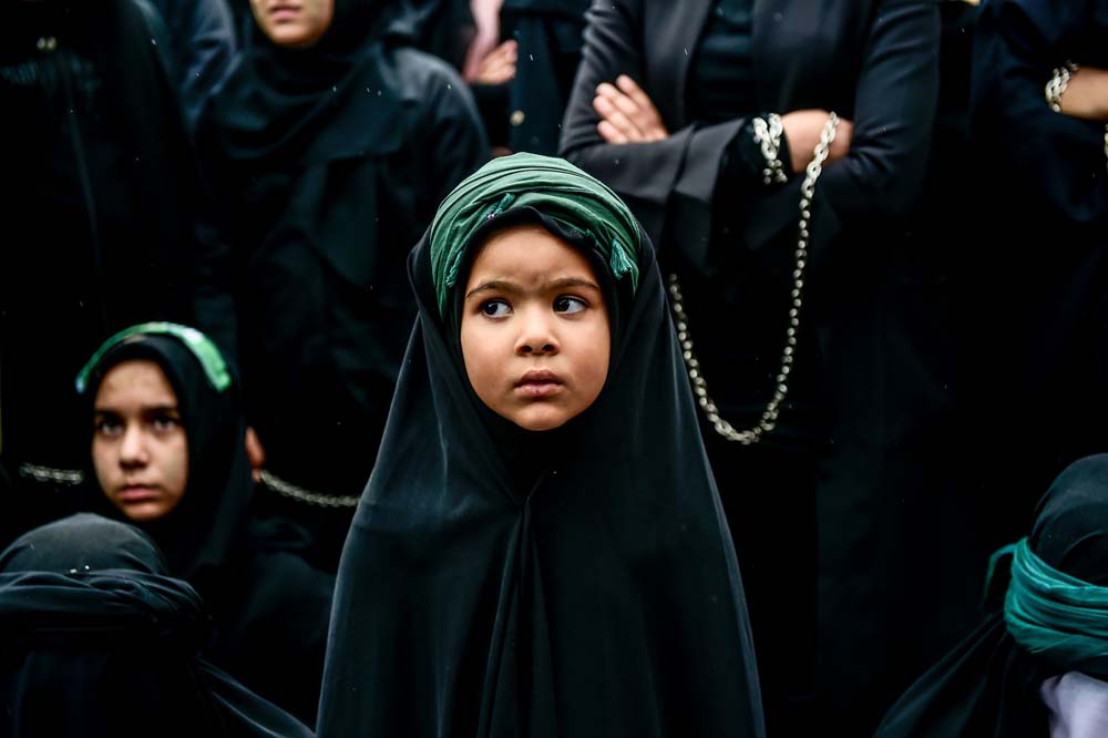 -A young girl takes part in a religious procession held on holiday of Ashura in Istanbul.  AFP 