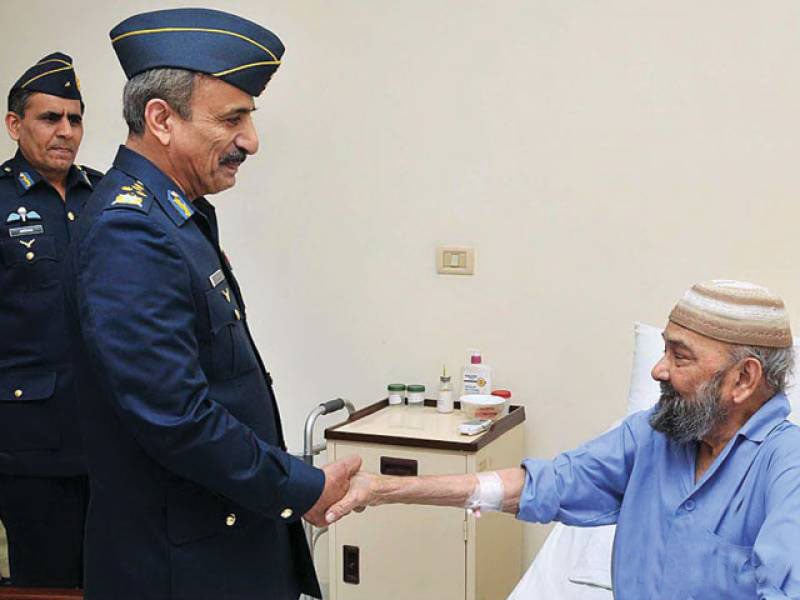 2013 file photo shows then Chief of the Air Staff, Air Chief Marshal Tahir Rafique Butt meeting Air Commodore (r) MM Alam.