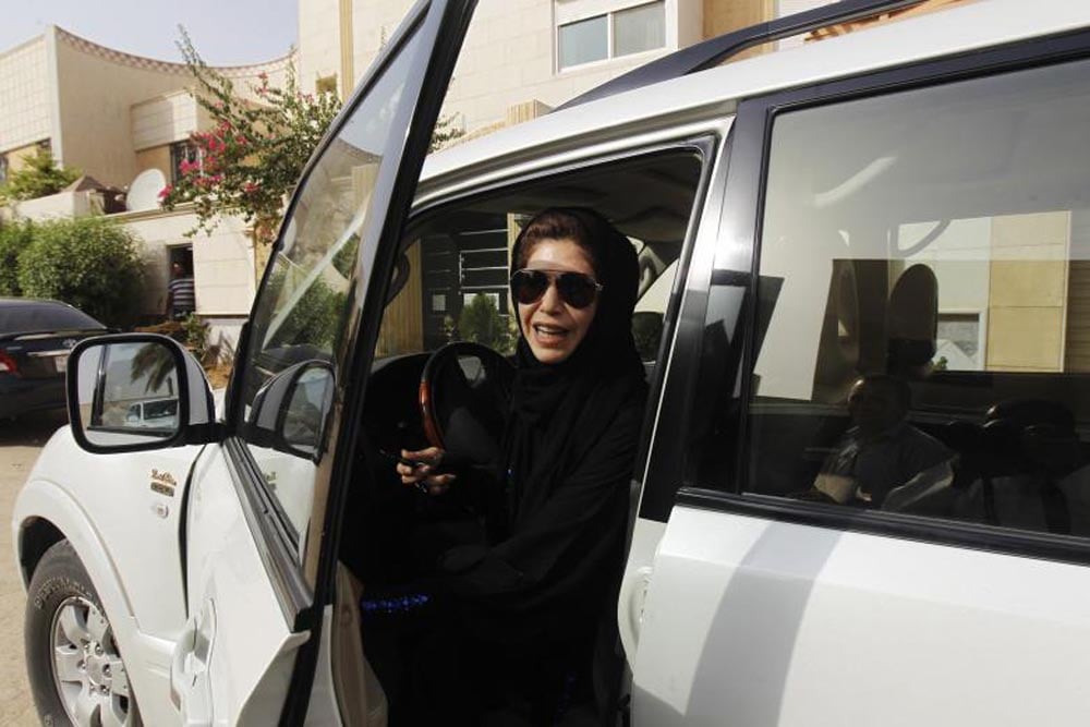 Female driver Azza Al Shmasani alights from her car after driving in defiance of the ban in Riyadh, June 22, 2011. REUTERS