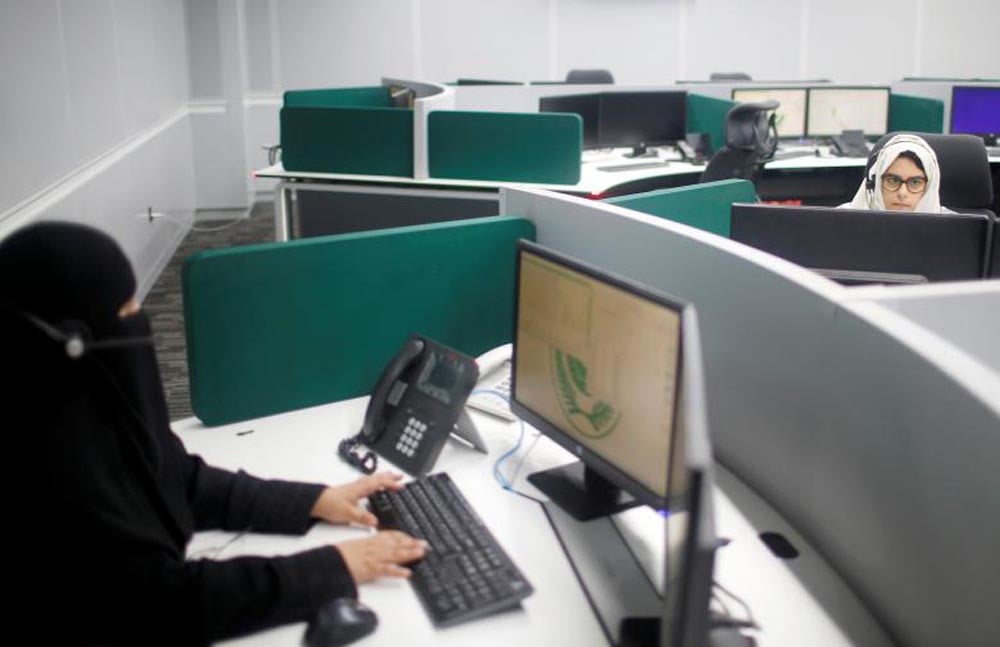 Women work inside the first all-female call centre in the kingdom