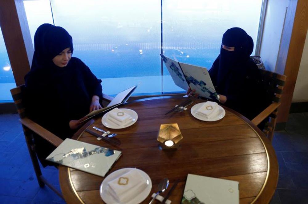 Women read menus in a cafe in Riyadh, October 6, 2016. REUTERS