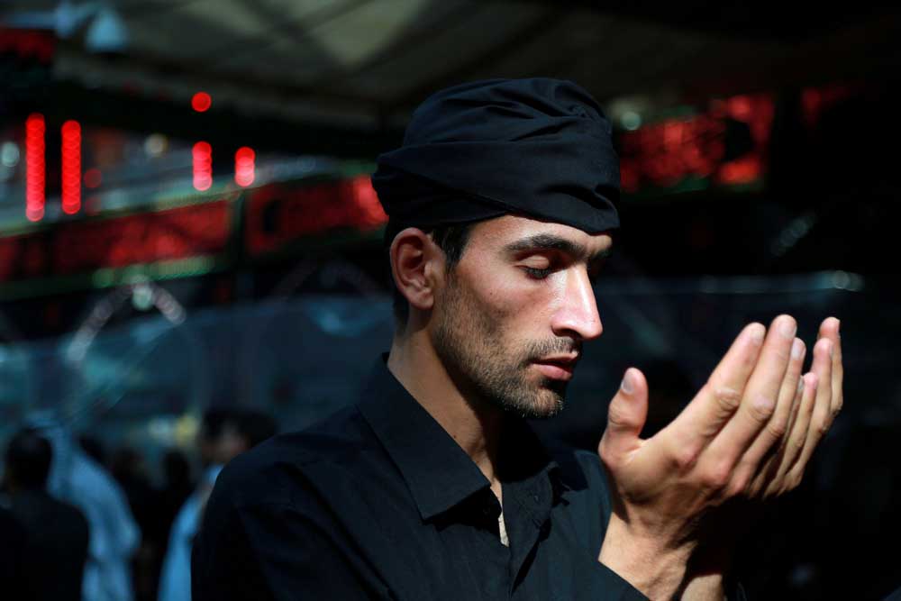 A pilgrim prays during a ceremony ahead of Ashura in Kerbala. REUTERS