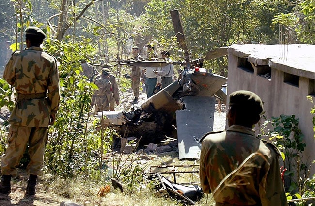 The wreckage of a military helicopter that crashed as its pilot tried to make an emergency landing