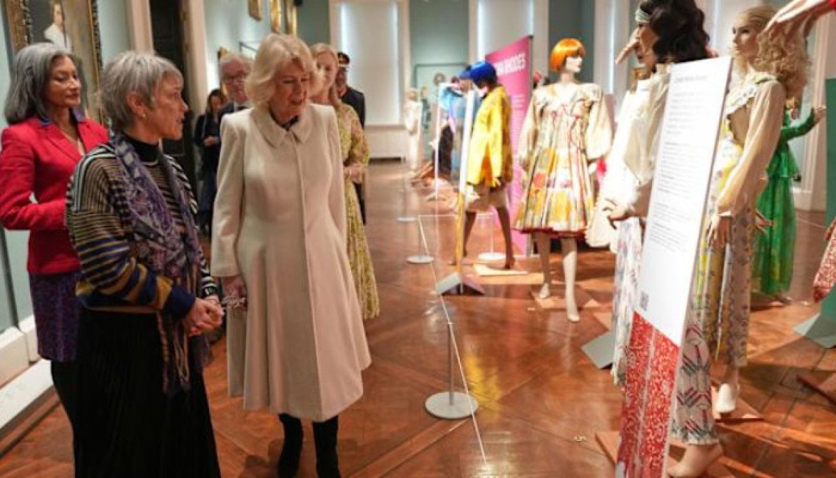 Queen Camilla tours special exhibit for historic fashion show