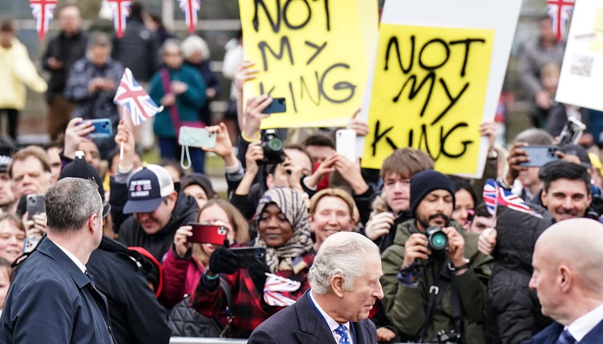 King Charles walks by as protestors cry: 'What did you know about Andrew?'  