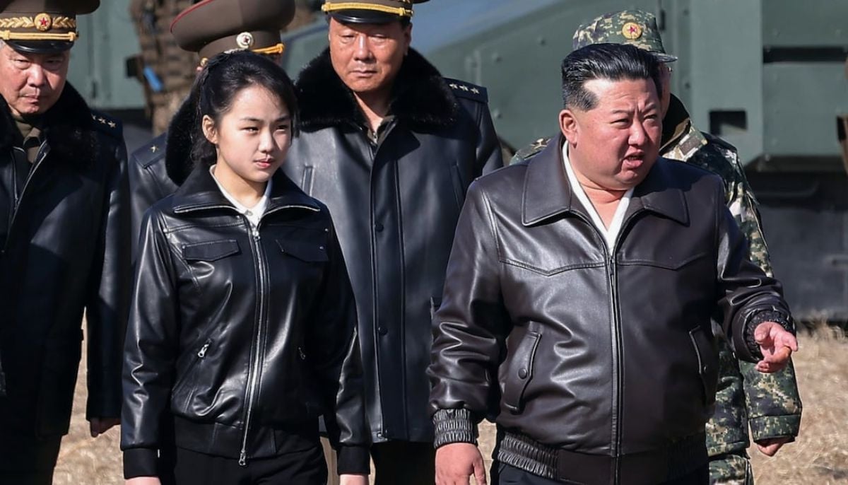 North Korean leader Kim Jong Un shares rare public moment with daughter on tank ride during military display 
