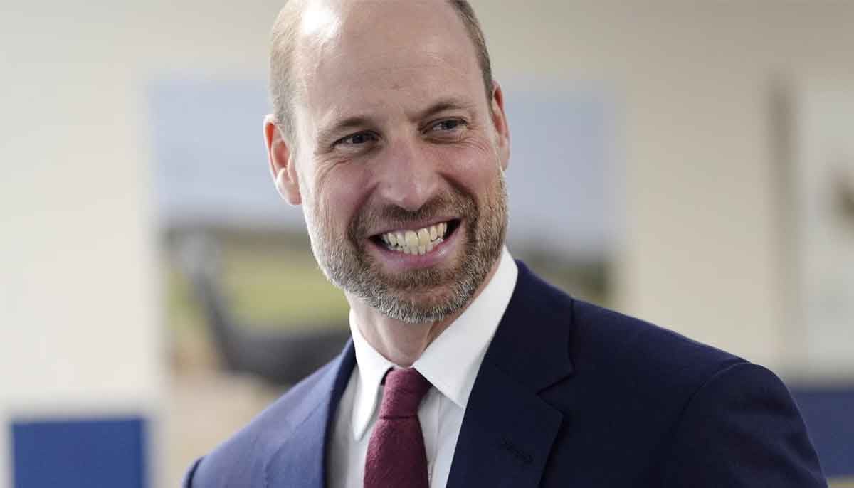 Prince William pilots boat during royal visit