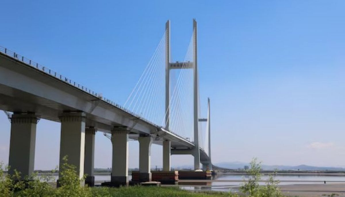 North Korea nears China bridge completion after opening Russia road link