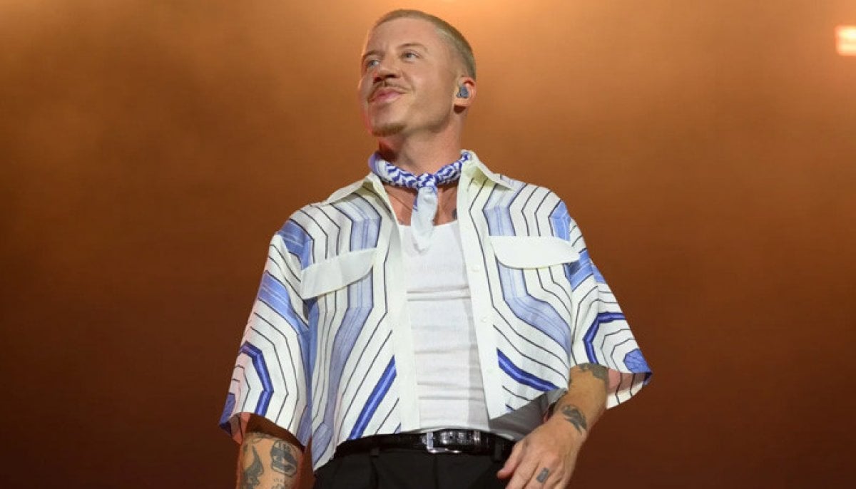 Macklemore reacts after being dropped from Ed Sheeran's U.S. Loop Tour