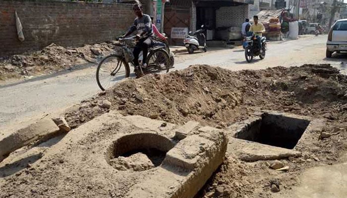 CBC looks the other way as DHA residents brave open manholes and streets flooded with sewage