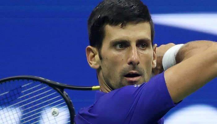Djokovic tested but wins to advance Slam quest