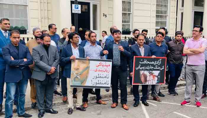 Journalists holding placards against the Pakistani governments move to establish Pakistan Media Development Authority (PMDA) outside Pakistan High Commission in London.