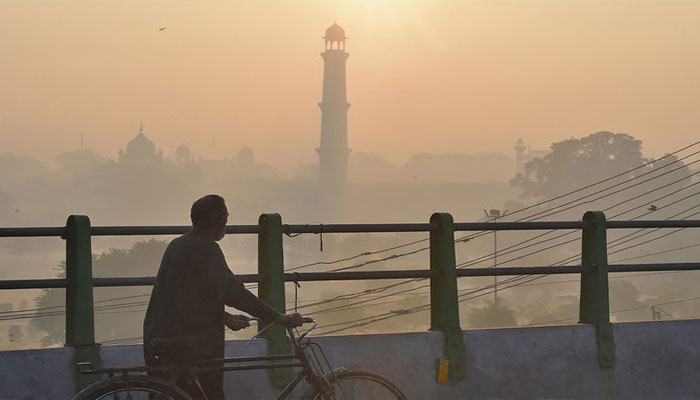 A man walking in Lahore amid smog. File photo