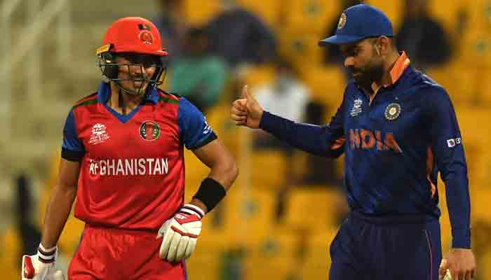 Indias captain Virat Kohli (R) gestures to Afghanistans Rahmanullah Gurbaz during the ICC Mens Twenty20 World Cup cricket match between India and Afghanistan at the Sheikh Zayed Cricket Stadium in Abu Dhabi on November 3, 2021. -AFP