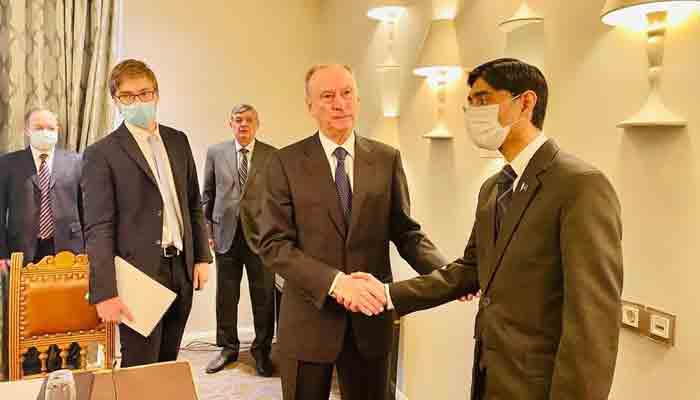 Pakistans National Security Adviser Dr Moeed Yusuf shakes hands with Nikolai Patrushev, Secretary of Russia’s Security Council, during his Moscow visit on Wednesday.—APP