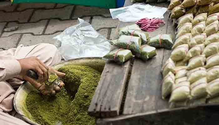 A roadside vendor packing naswar for sale.-File photo
