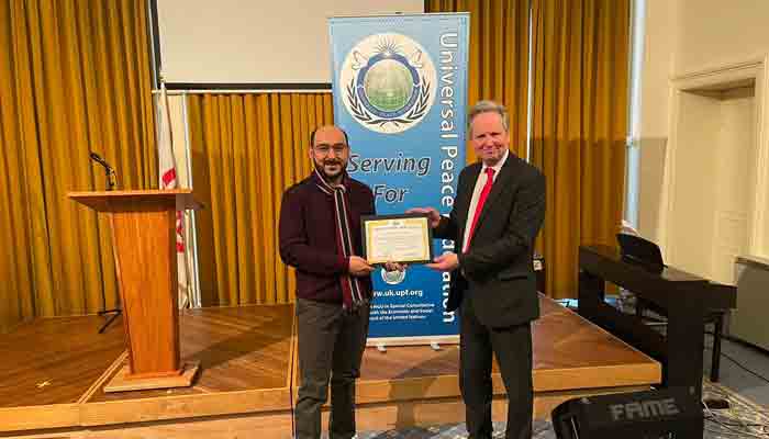 Syed Ali Haider Gilani receiving a certificate from the Universal Peace Foundation (UPF). Photo by reporter