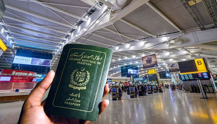 A man holding Pakistani passport in his hands. -File photo