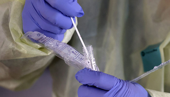 Chinese officials urge elderly to get Covid vaccine, cite lesson of Hong Kong