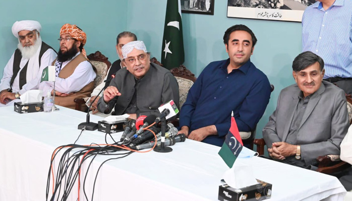 PPP supremo Asif Zardari (centre) speaks to media in Islamabad after MNA Aslam Bhootani announced to join the Opposition ranks on Tuesday, March 30. -Courtesy PPP