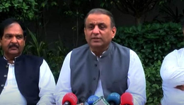 Disgruntled PTI member Aleem Khan addressing a press conference in Lahore on April 4, 2022. Twitter