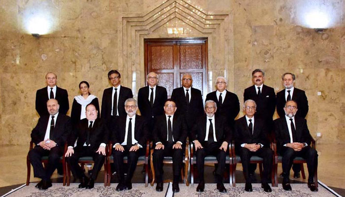 Judges of the Supreme Court of Pakistan in a group photo at the apex courts premises in Islamabad on the retirement of Justice Maqbool Baqir. -- APP