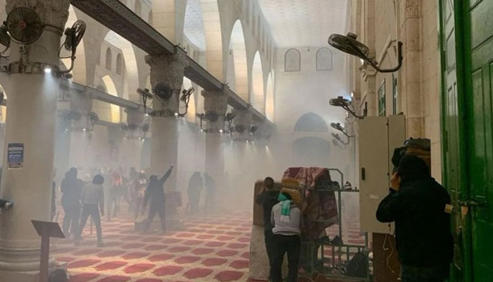 Al-Aqsa Mosque being raided by Israeli police. Photo: Twitter/KhaledBeydoun