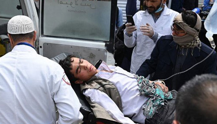 A wounded student being shifted to a hospital after twin bombings hit a school in Kabul on April 19, 2022. Photo: Twitter