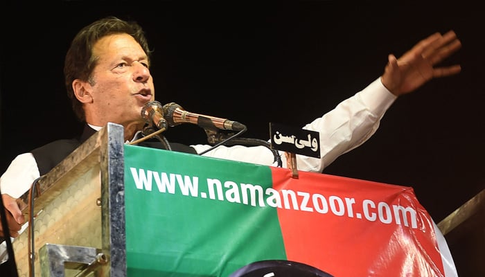 Former Pakistan prime minister Imran Khan addresses Pakistan Tehreek-e-Insaf (PTI) party supporters during a rally in Lahore on April 21, 2022. -AFP