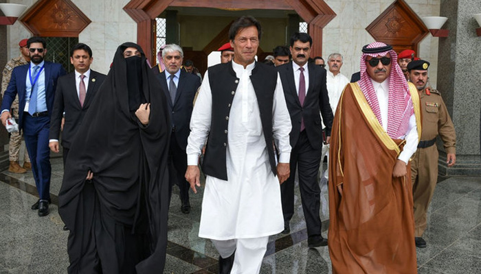 In this May 2019 photo, former prime minister Imran Khan and his wife visiting the Prophet Mosque (PBUH) in Madina. -SPA/File