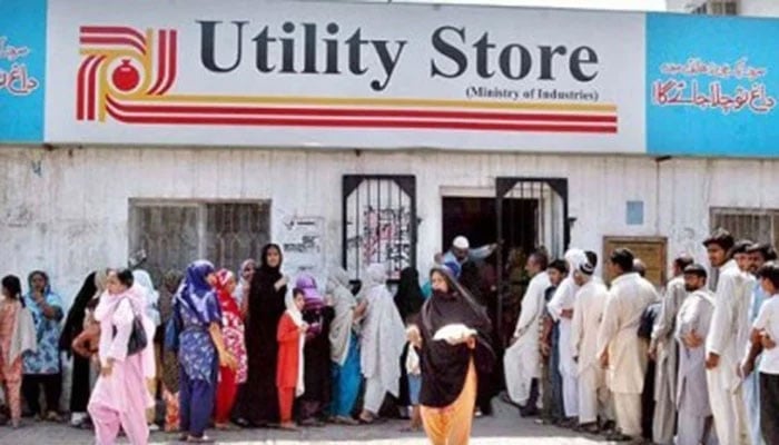 People seen queued up in front of a Utility Store. Photo: The News/File