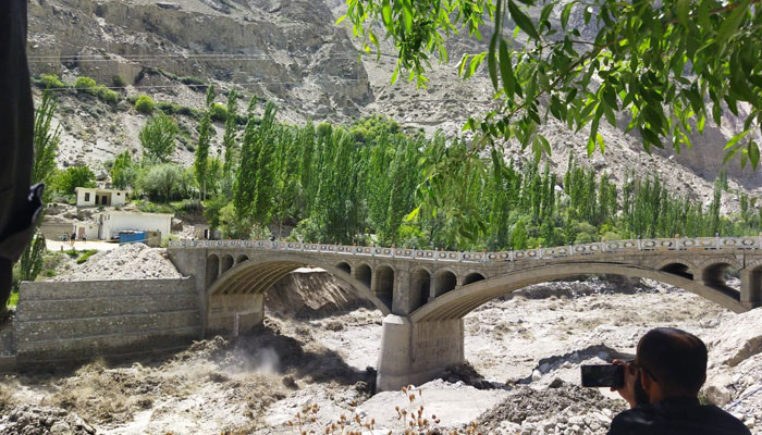Hassanabad Bridge built under CPEC, connecting the Hunza Valley to Pakistan, has given way to massive Glacial Lake Outburst Flood on May 7, 2022. Photo: Twitter/ShabbirMir