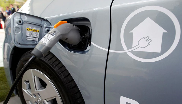 In this April 2010 photo, an electric wire is plugged into a Toyota Prius Plug-in hybrid car during a media presentation in Strasbourg. Agencies