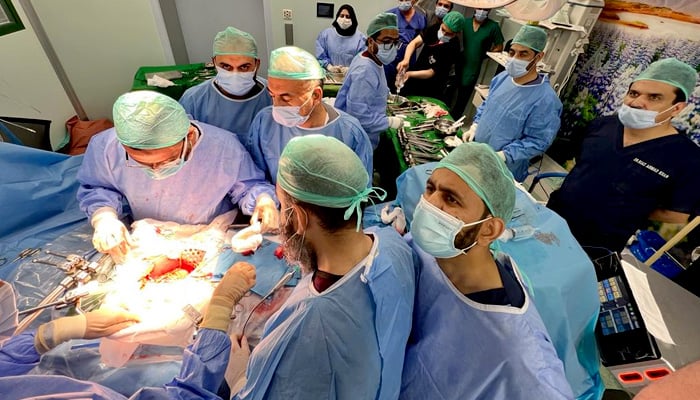 Doctors performing a kidney transplant surgery at the Hayatabad Medical Complex, Peshawar. -Picture Taimur Khan Jhagra