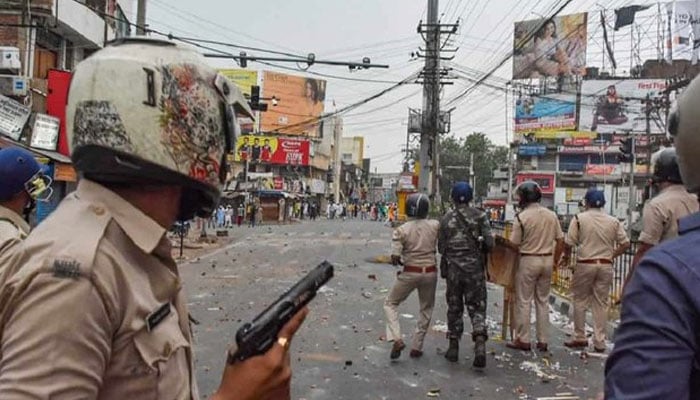 Indian police seen opening direct fire at the people protesting blasphemous remarks. Photo: Indian media