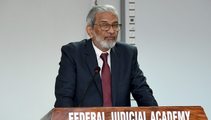 Justice (retd) Maqbool Baqir speaks during a conference held in Islamabad. Twitter