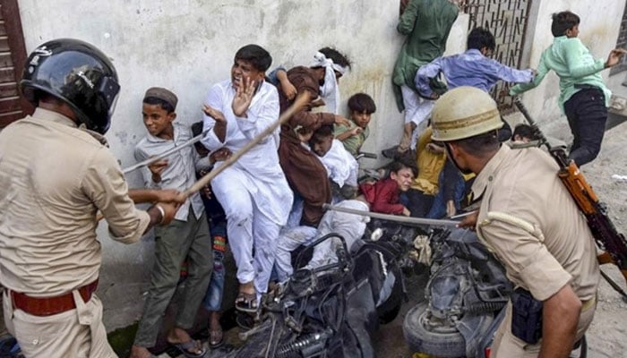 Indian police seen torturing children who protested against the blasphemous statements by the BJP members. Photo: Twitter