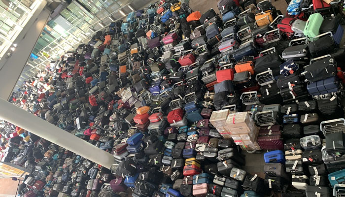 Hundreds of suitcases pile up at Heathrow